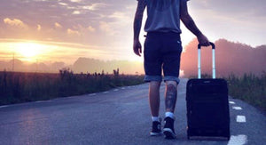 Man Traveling with Suitcase